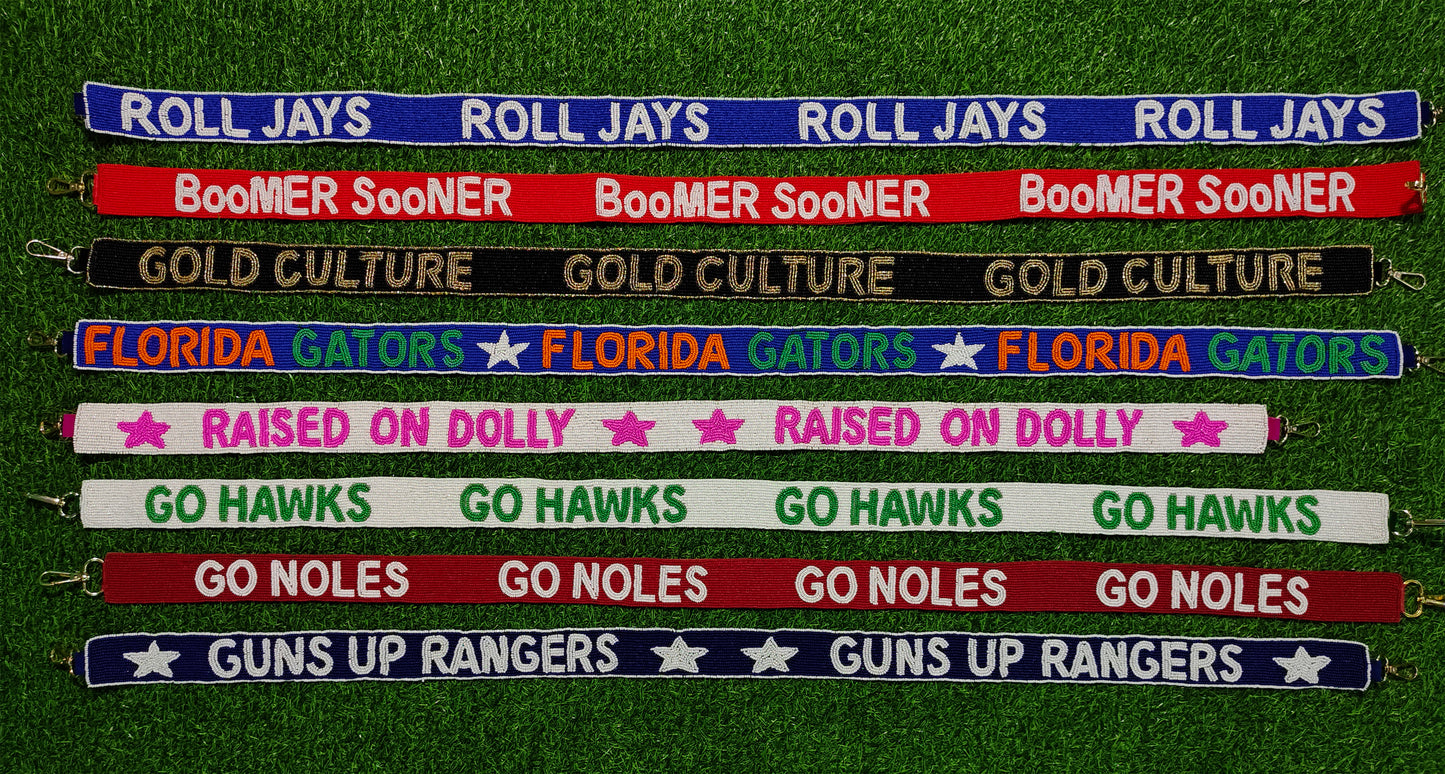 Beaded Purse Strap – "Roll Jays," "Boomer Sooner," "Gold Culture," "Florida Gators," "Raised on Dolly," "Go Hawks," "Go Noles," and "Guns Up Rangers!"