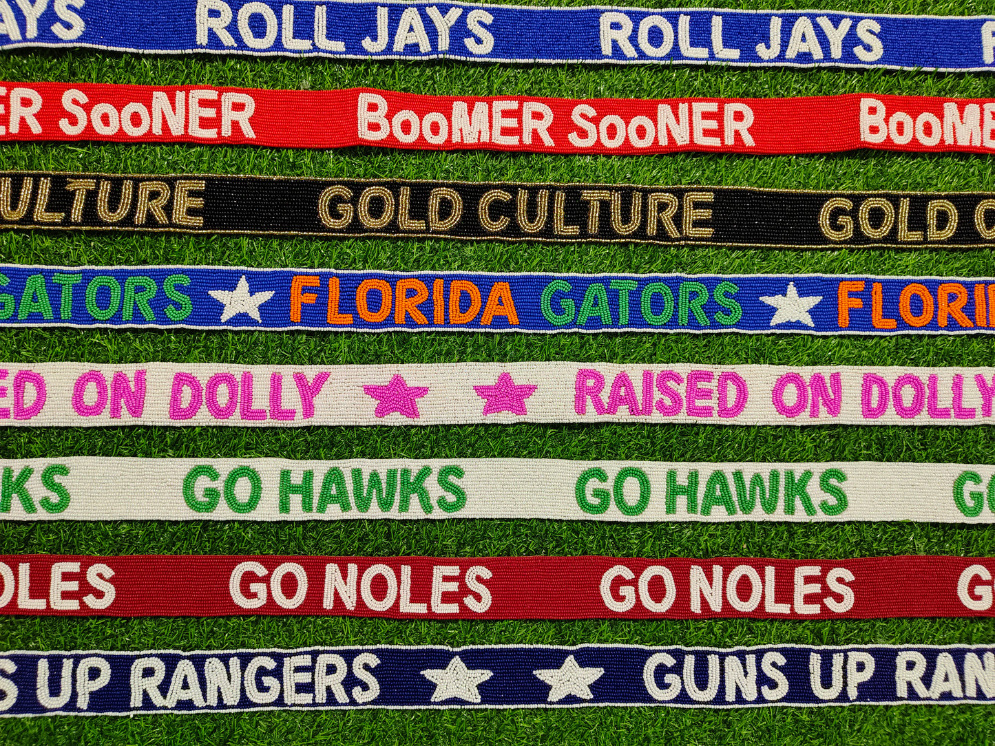 Beaded Purse Strap – "Roll Jays," "Boomer Sooner," "Gold Culture," "Florida Gators," "Raised on Dolly," "Go Hawks," "Go Noles," and "Guns Up Rangers!"