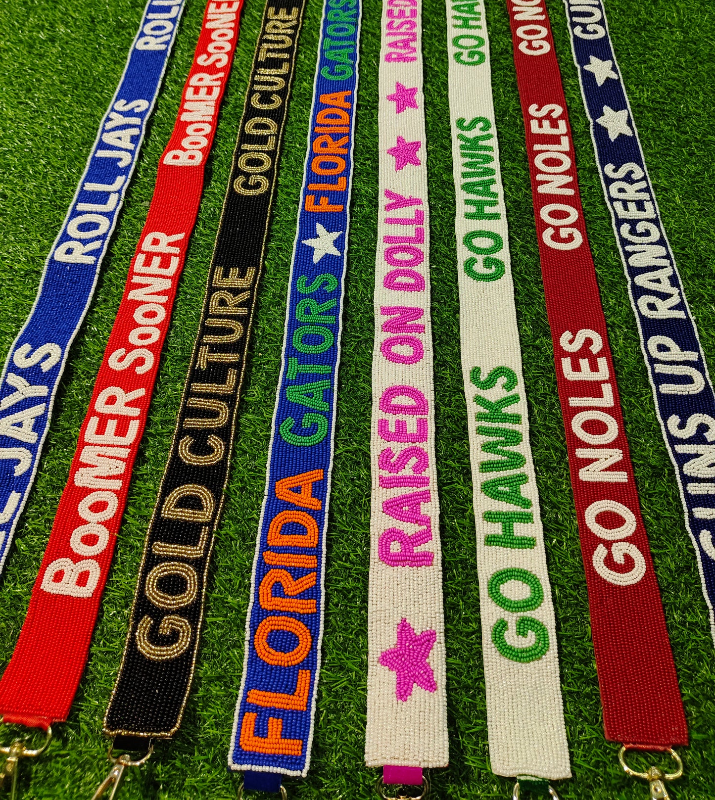 Beaded Purse Strap – "Roll Jays," "Boomer Sooner," "Gold Culture," "Florida Gators," "Raised on Dolly," "Go Hawks," "Go Noles," and "Guns Up Rangers!"