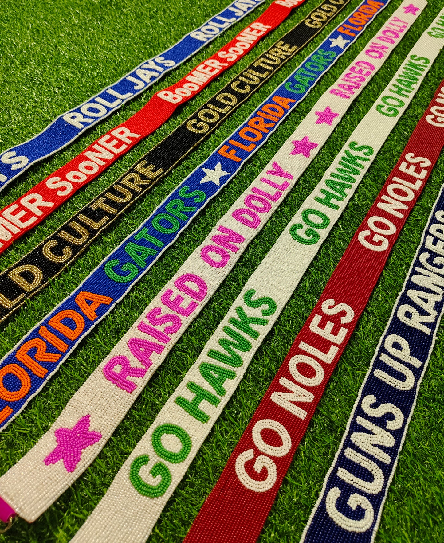 Beaded Purse Strap – "Roll Jays," "Boomer Sooner," "Gold Culture," "Florida Gators," "Raised on Dolly," "Go Hawks," "Go Noles," and "Guns Up Rangers!"